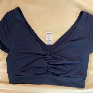 Womens black athleisure crop top- spandex/dry fit material- never worn! Size LG